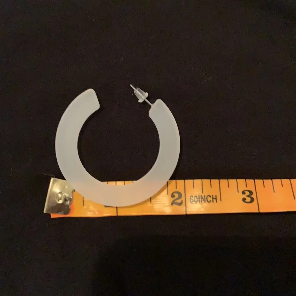 13. Earrings:   Off White Semi Opaque Hoops
